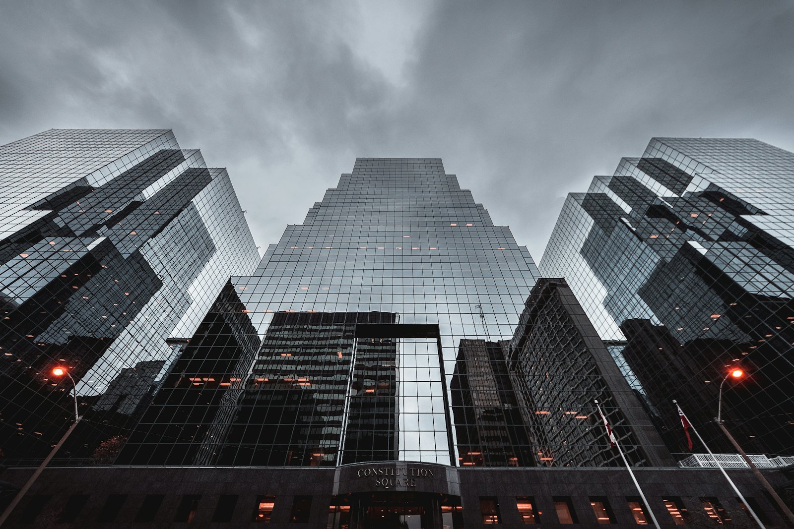 Glass and steel residential architecture reflecting the sky