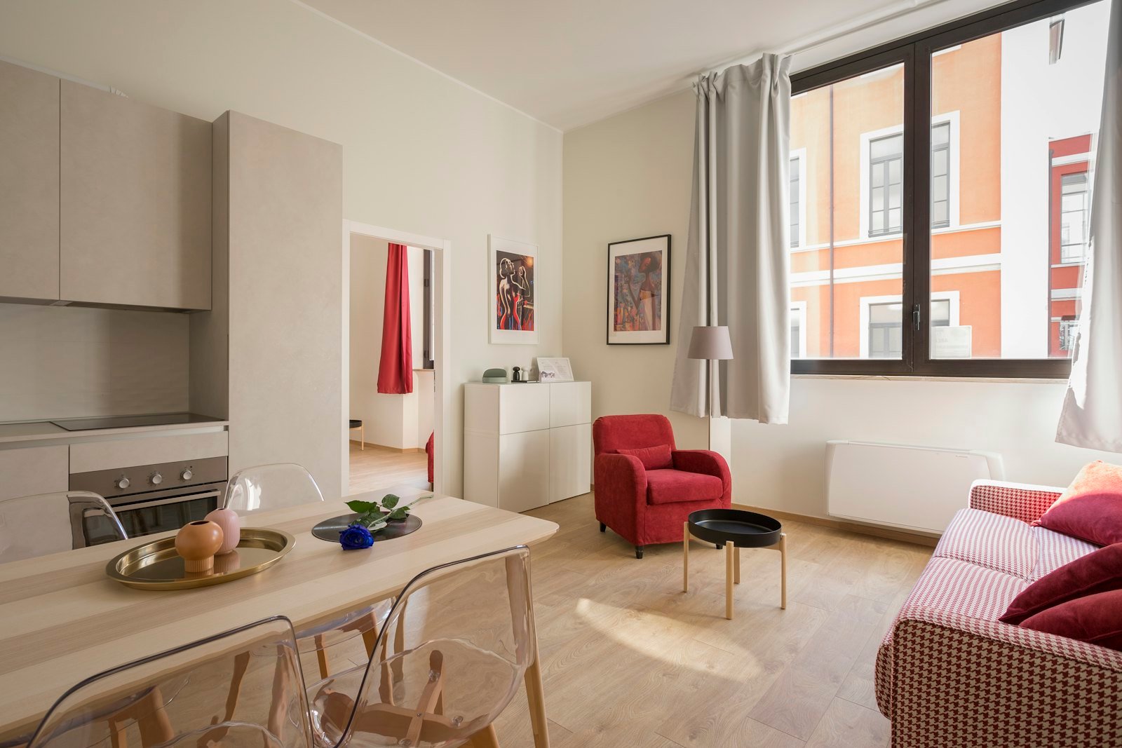 Bright apartment interior with a sofa and boxes being unpacked