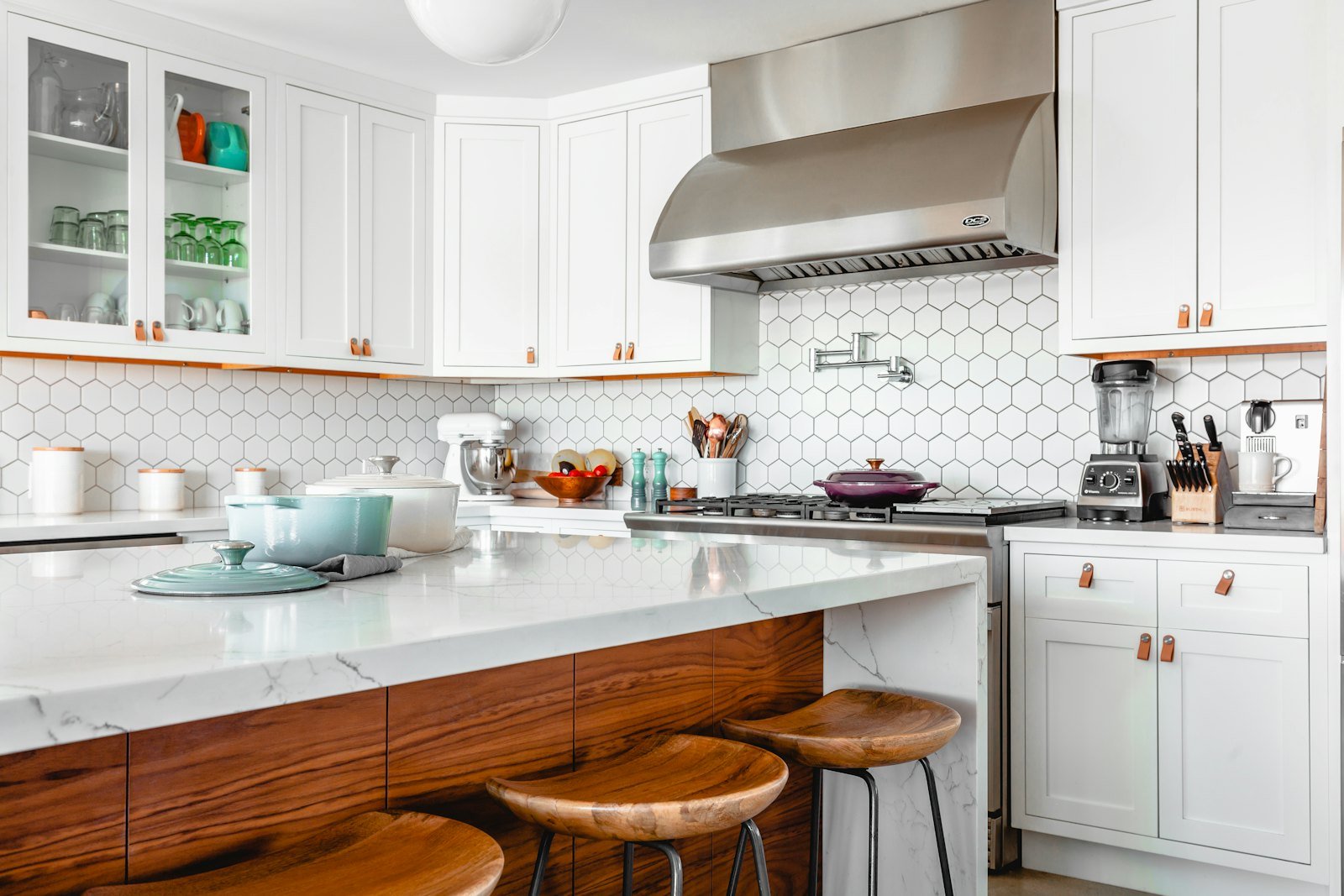 Kitchen with stone surfaces and concealed storage