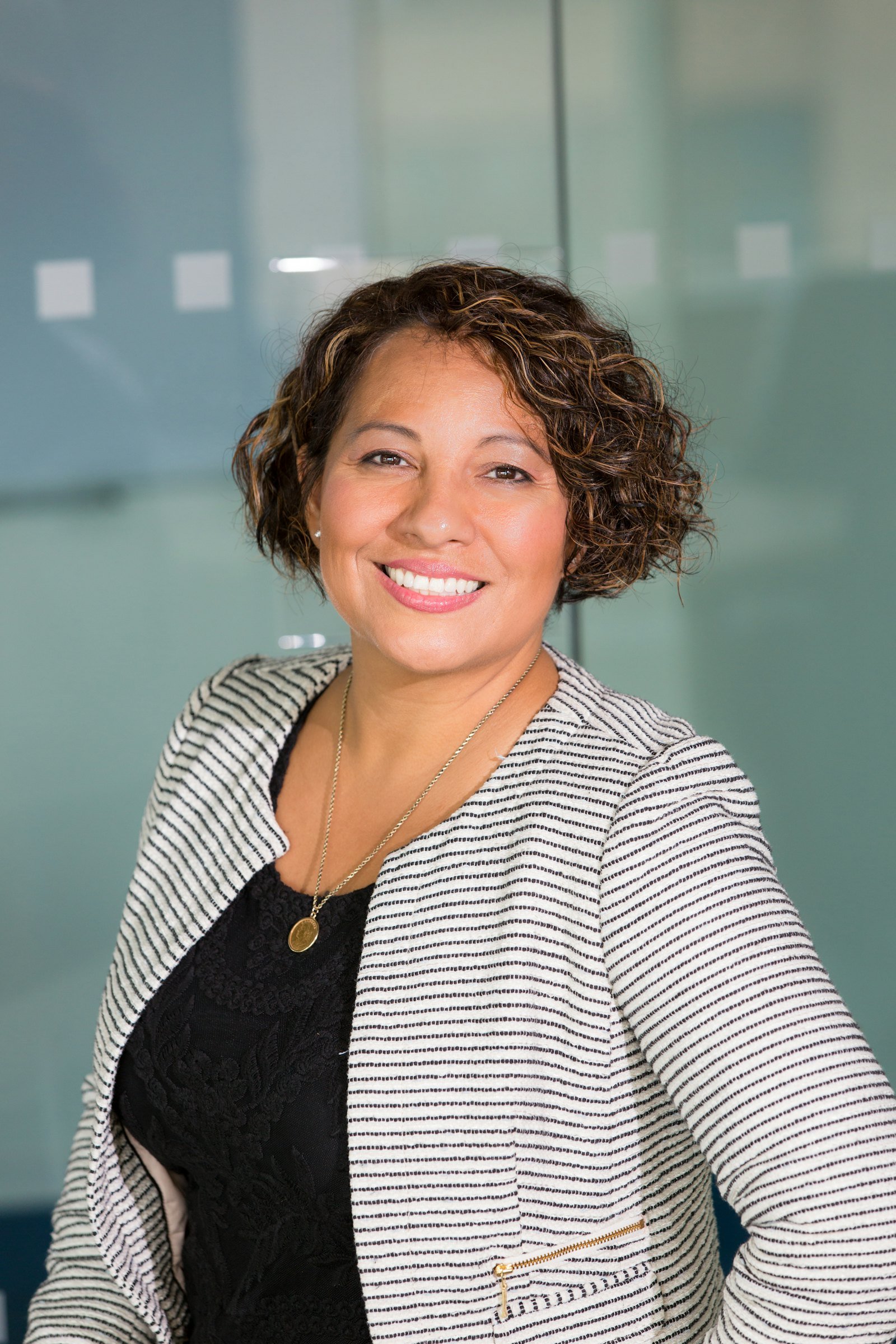 A property advisor smiling in a bright office